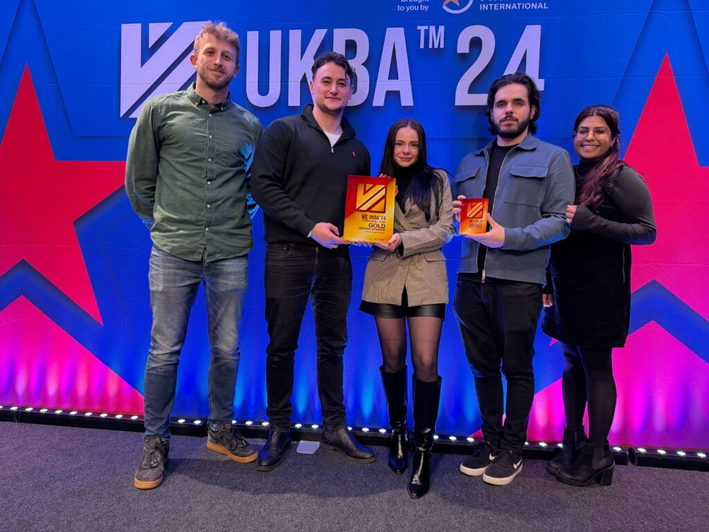 MyOutreach team holding award at UKBA 24